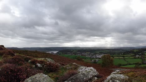 Moody-rolling-stormy-overcast-clouds-moving-left-timlapse-of-rural-English-countryside-farmland