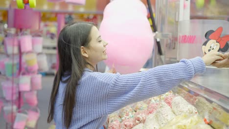 teenage girl at a candy shop