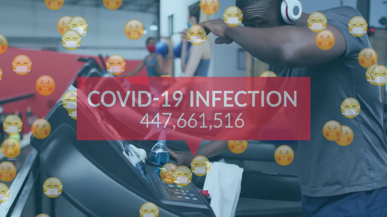 Animation of words covid-19 infections and emojis over diverse group wearing face masks working out