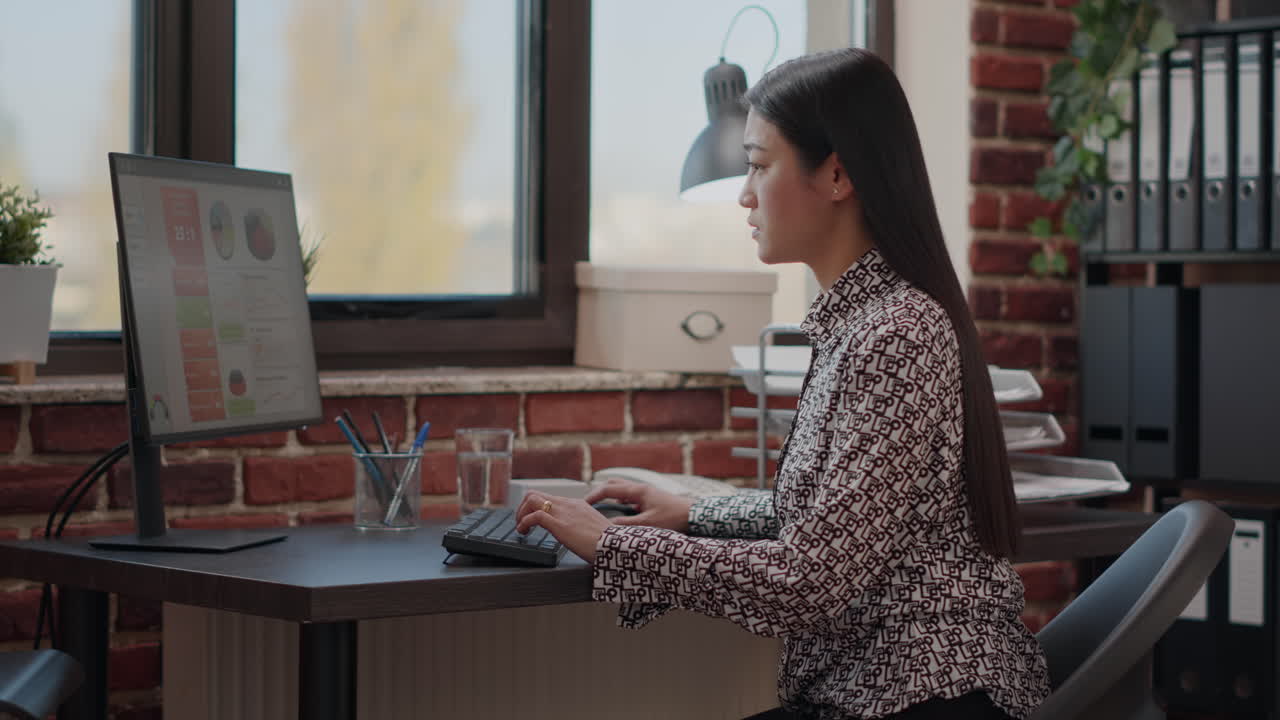 Person dealing with backache while she works on business strategy