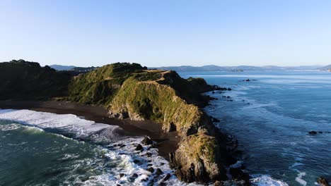 peninsula on rocky coast of castletown, new zealand - amazing aerial view