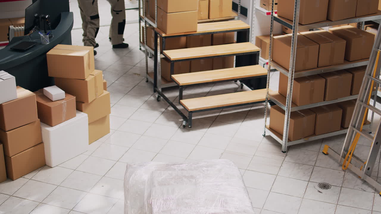 Warehouse workers handling boxes and inventory