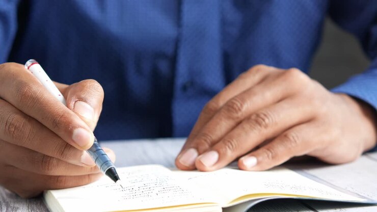 Person writing in a notebook