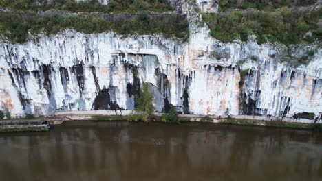 towpath carved in rock by river, tranquil scene with historical roots