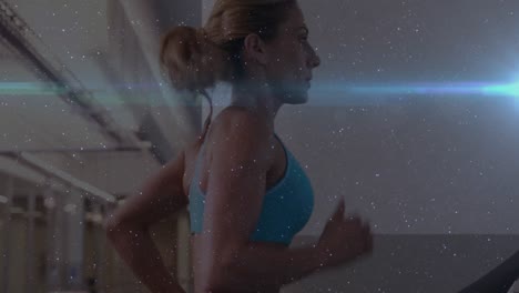 Animation-of-Caucasian-woman-running-on-treadmill-in-gym-with-blue-light-moving-in-the-foreground