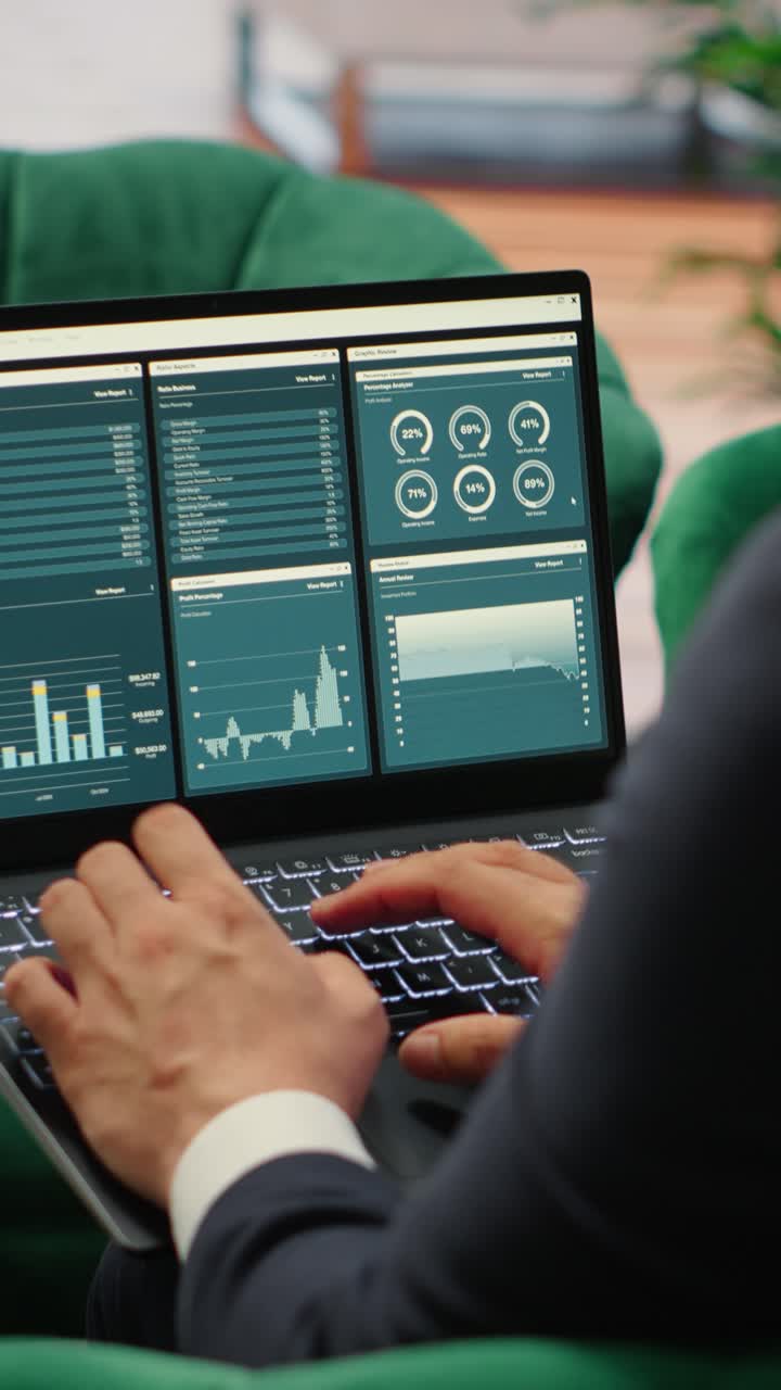 Vertical Video Determined CEO works in office analyzing infographics and setting business goals