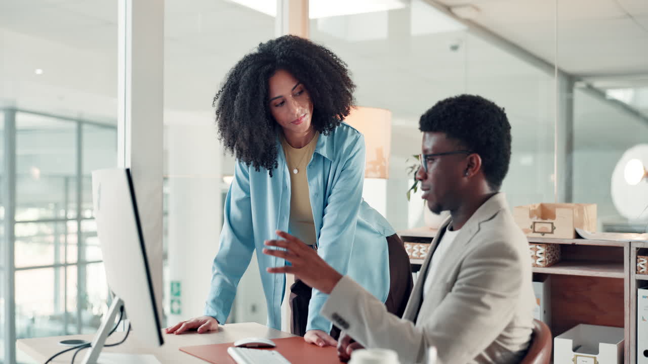 Two colleagues working together in the office