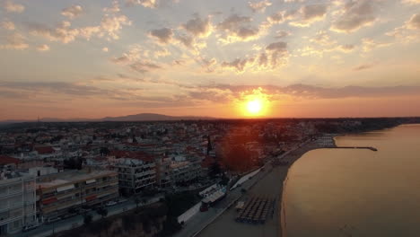 Aerial-scene-of-coastal-resort-town-at-sunrise-Nea-Kallikratia-Greece