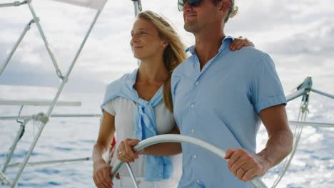 happy couple sailing on yacht