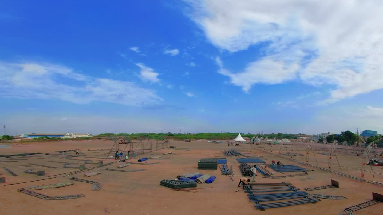 Different parts of metal scaffold on the construction field, Workers build an industrial doom, worker build a concert stage