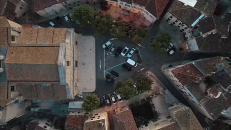 top-down rising shot revealing the église notre-dame-de-l'assomption de lambesc in france