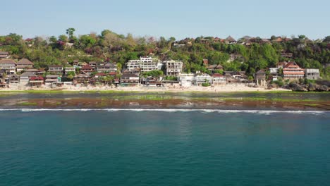 The-surf-spot-of-Bingin-at-the-cliffs-of-Uluwatu-during-a-sunny-day