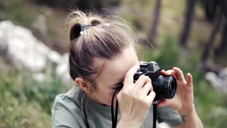 Slim-professional-caucasian-woman-photographing-nature-on-in-the-natural-park