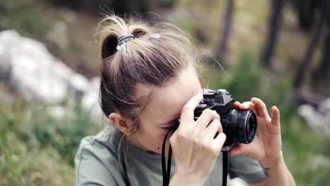 slim professional caucasian woman photographing nature on in the natural park