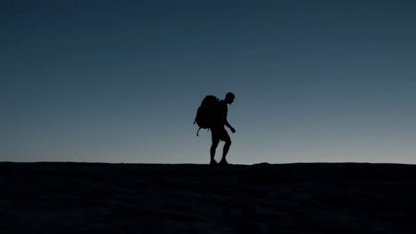 silhouette of a hiker at dusk