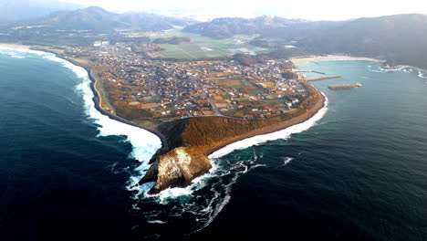 wide revealing drone shot of coastline at kyushu japan