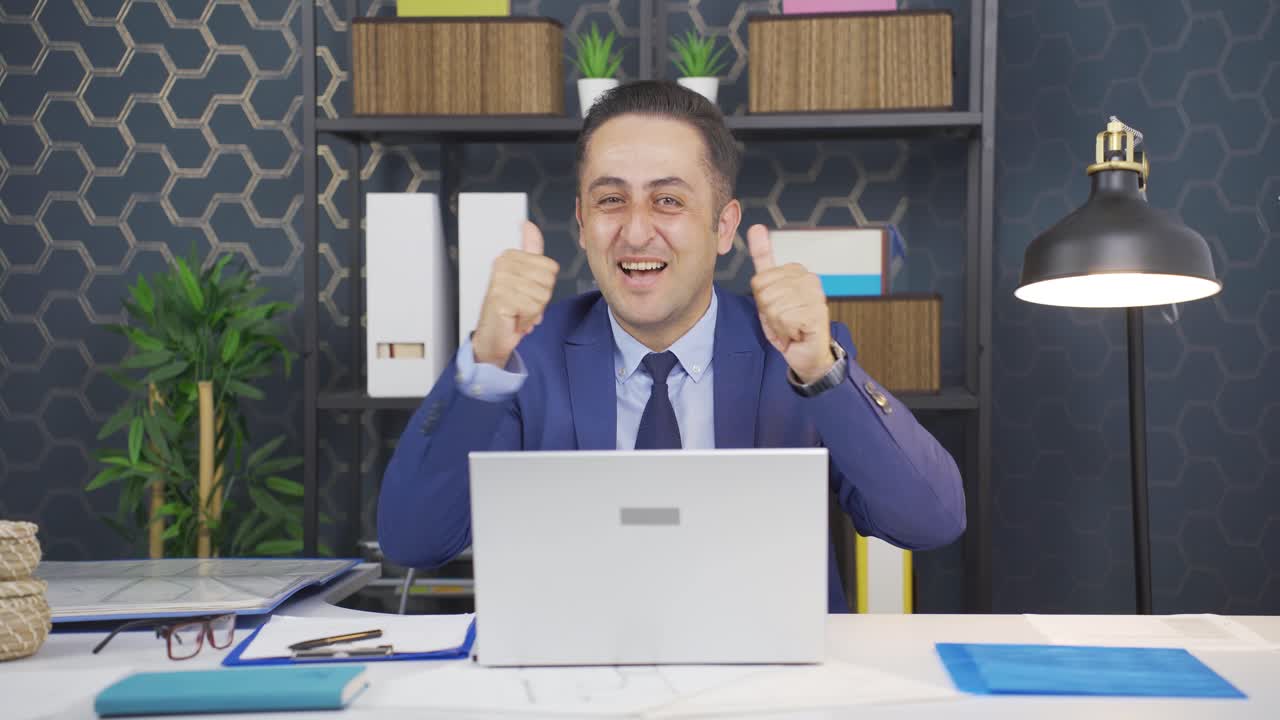 Excited businessman clapping at camera.