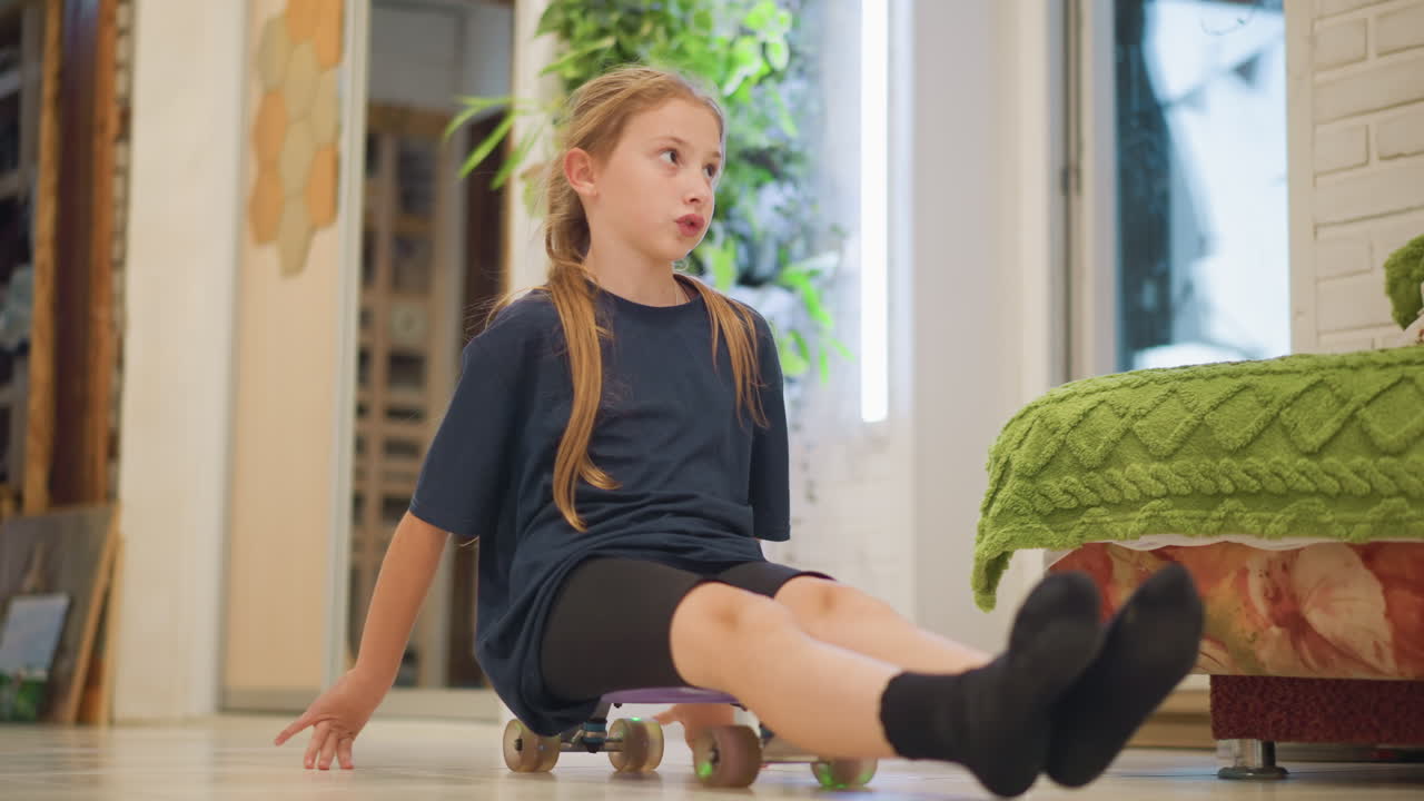 White girl sliding on kitchen floor at home on small skateboard, braided hair and calm expression, reflected in mirror beside potted plant, warm indoor light and soft decor, intimate closeups and slow
