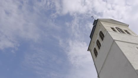 church tower under a cloudy sky