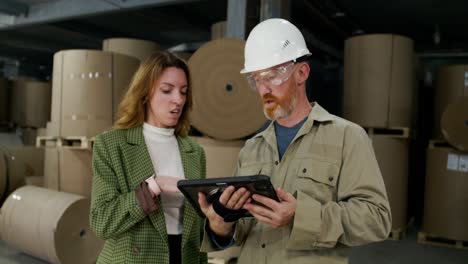 business meeting in a paper warehouse