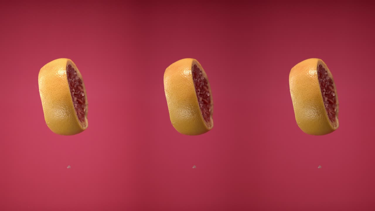 rebanadas de pomelo frescas lanzadas volando colgando en el aire y cayendo