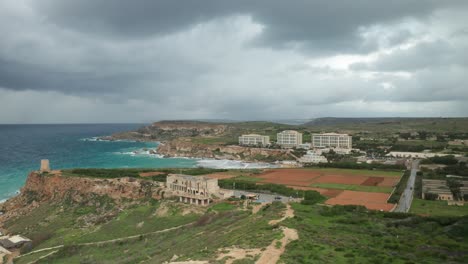 AERIAL:-Flying-to-Golden-Beach-Above-Farm-Land-On-a-Stormy-Day