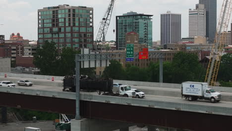 vehicles transit across arkansas river bridge i-30 highway construction, little rock, ar - aerial dolly in