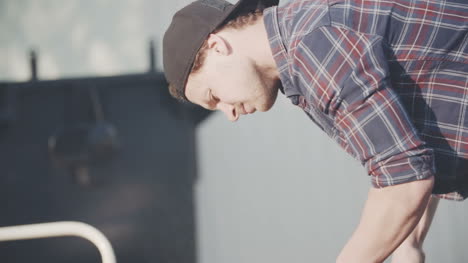 Handsome-Man-Working-In-Garden-Using-Chainsaw-