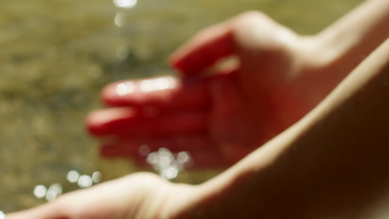 Hands catching water