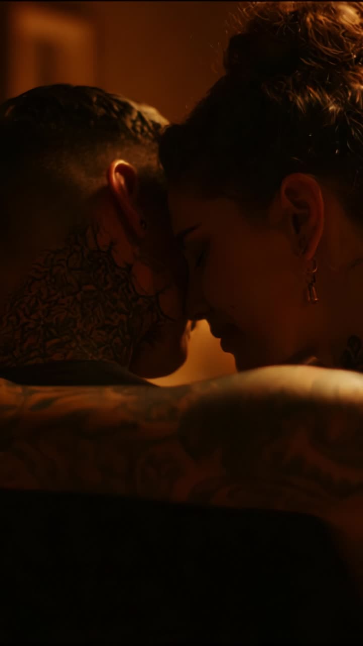 A Tender Moment of Intimacy Between Two Individuals, Capturing the Emotional Connection and Close Affection Through Their Embrace and Shared Secrets in the Dim Light