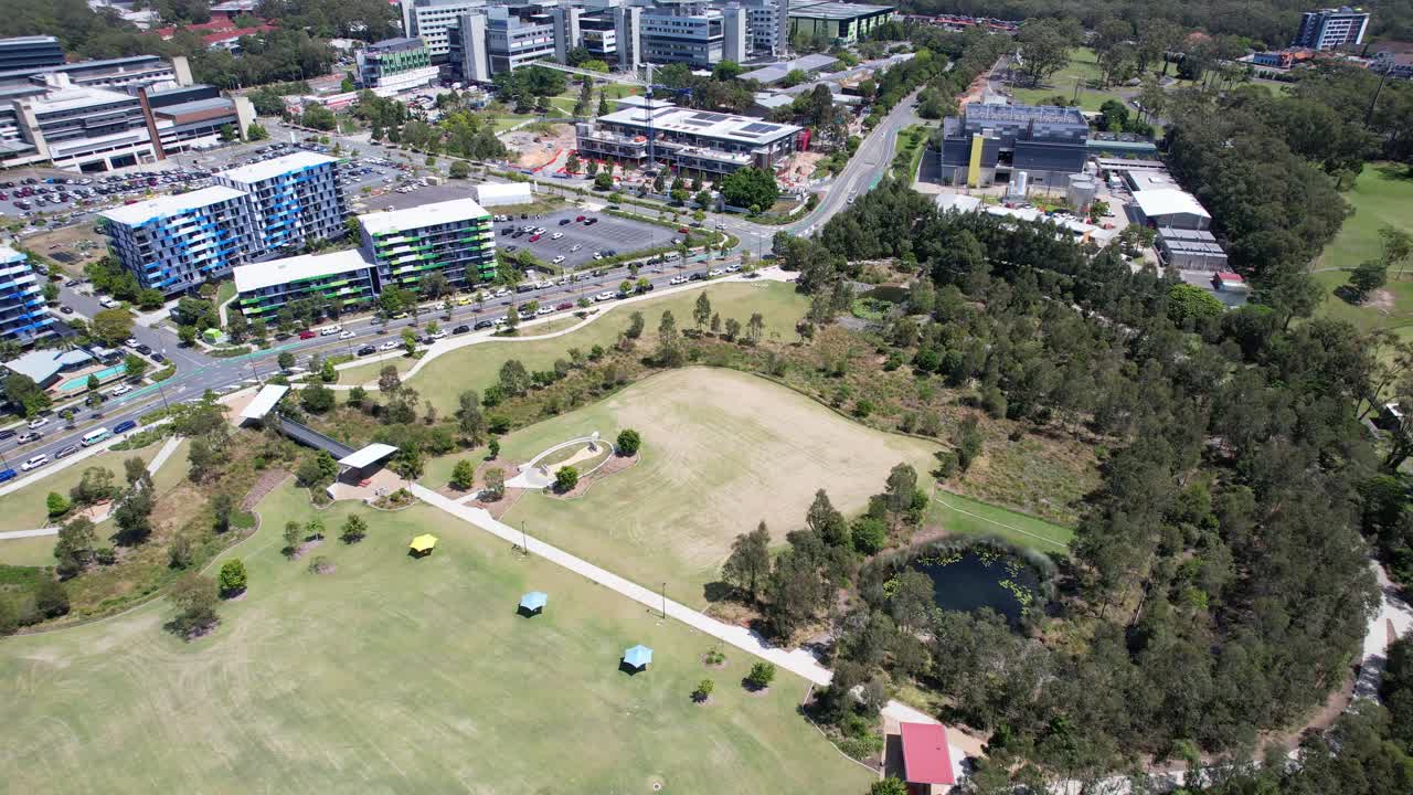 Village Heart Park And Apartment Buildings Near Gold Coast University Hospital In Southport, Queensland, Australia. Aerial Drone Shot
