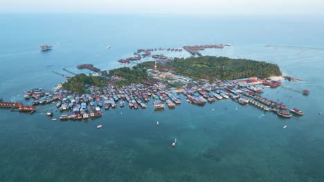 high orbiting shot of the whole mabul island housing the bajau laut community