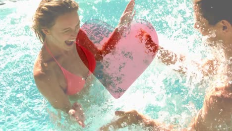 couple playing with water