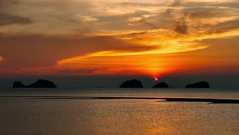 drone shot on the beach looking at the sun goes down