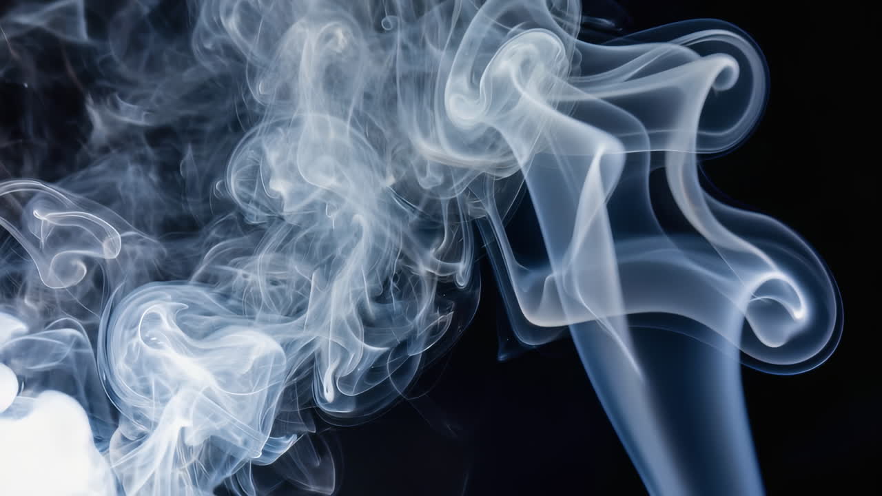 Slow-motion loop of soft white smoke swirling gracefully on a pure black background. Fine detail and premium lighting. Versatile luxury backdrop