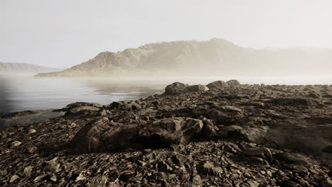 atmospheric landscape with mountain lake among moraines in rainy weather