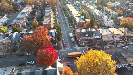 yellow school bus stopped in urban community