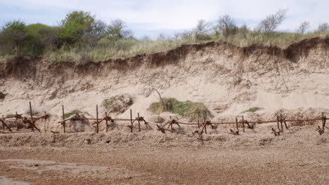 coastal erosion on the beach in the uk