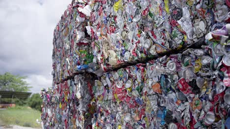 compressed aluminum cans awaiting shipment for recycling