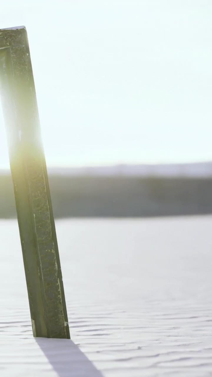 Walking on sand at sunset by the beach with soft waves nearby