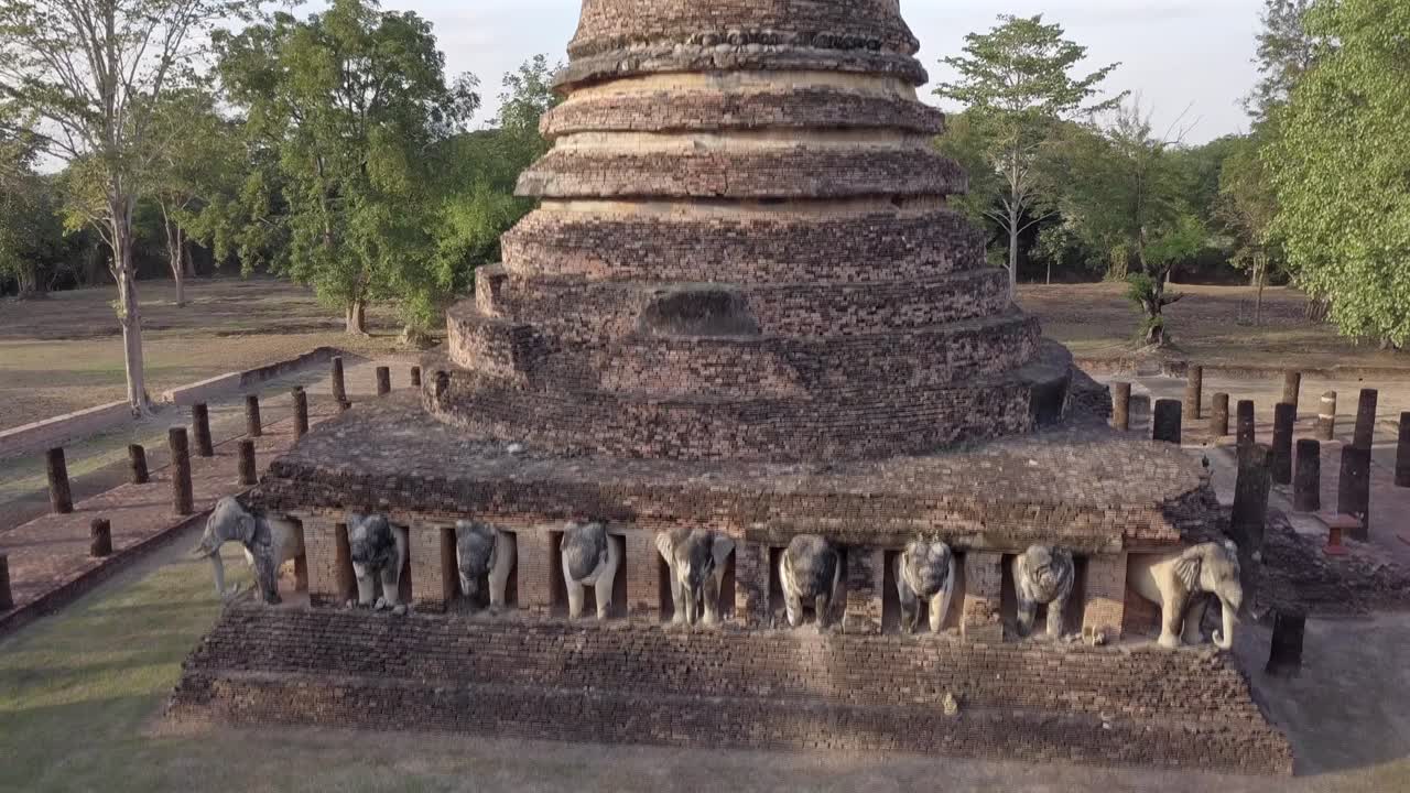 Aerial view of Wat Chang Lom at Si Satchanalai Historical Park,Thailand.Descending and backwards.