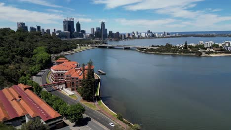 aerial drone view flying towards, and over the old swan brewery next to swan river in perth