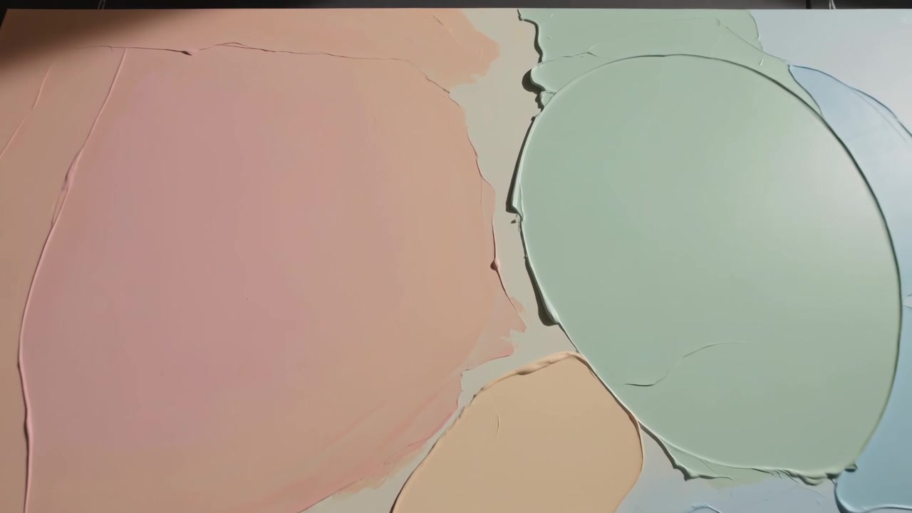 Clip starting, zooming camera revealing paint panel on studio table, showing tool marks and layout