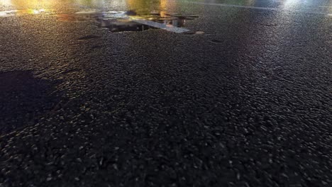 3d heavy rain hitting road at night - 4k realistic rain particle (loopable) - rainy day on a colorful street with traffic - wet road at night - low angle shot of in the rain - rainfall and reflection on road - loopable moving image - turkey - istanbul