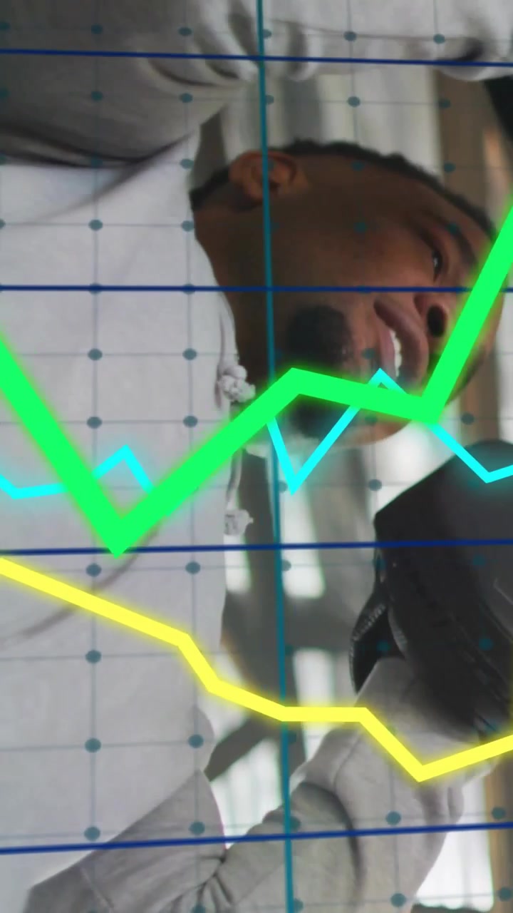 Vertical video: Man starting shoulder lift regripping while fitness graphs on grid tracking gains