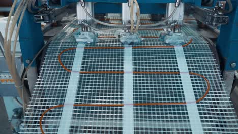 línea de producción de sistemas automáticos de calefacción por suelo