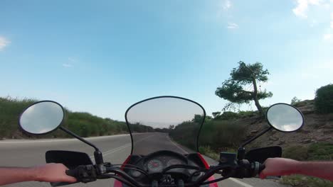 riding a motorcycle on penteli mountain in greece