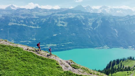 couple hikes the breathtaking hardergrat ridge in switzerland, slow motion view