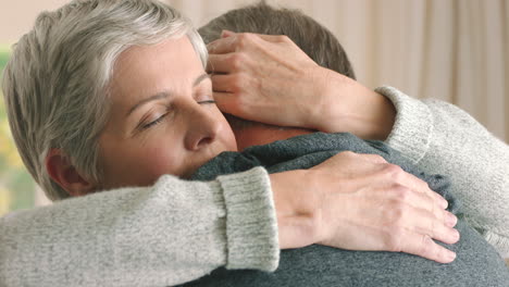 sad senior couple hug, gives support