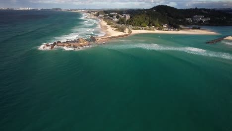 aerial view of currumbin with surfers, gold coast, queensland, australia - drone shot